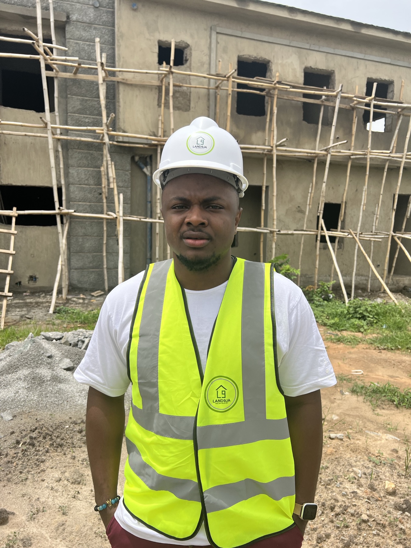 Daniel Okechukwu on site in front of scaffolding